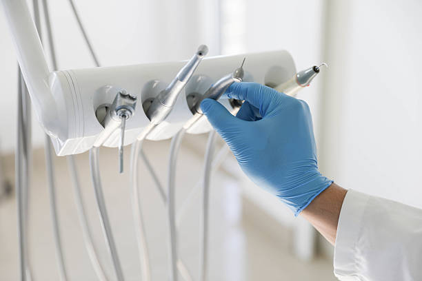 Professional Tooth Extraction technician working in Stewart Manor, NY